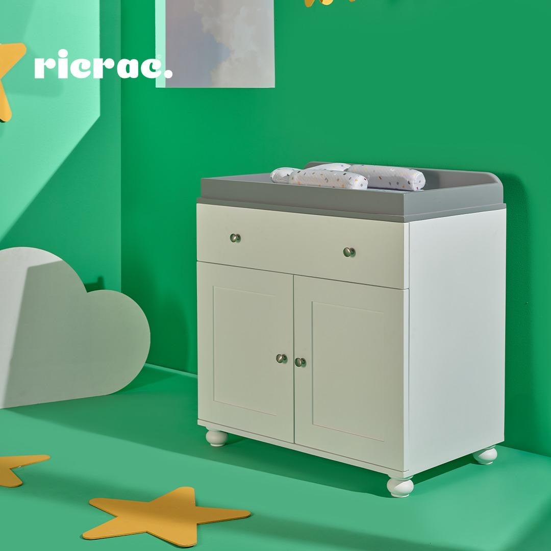 Rapal full set room changing table in a nursery with a green background, designed for safety and convenience.