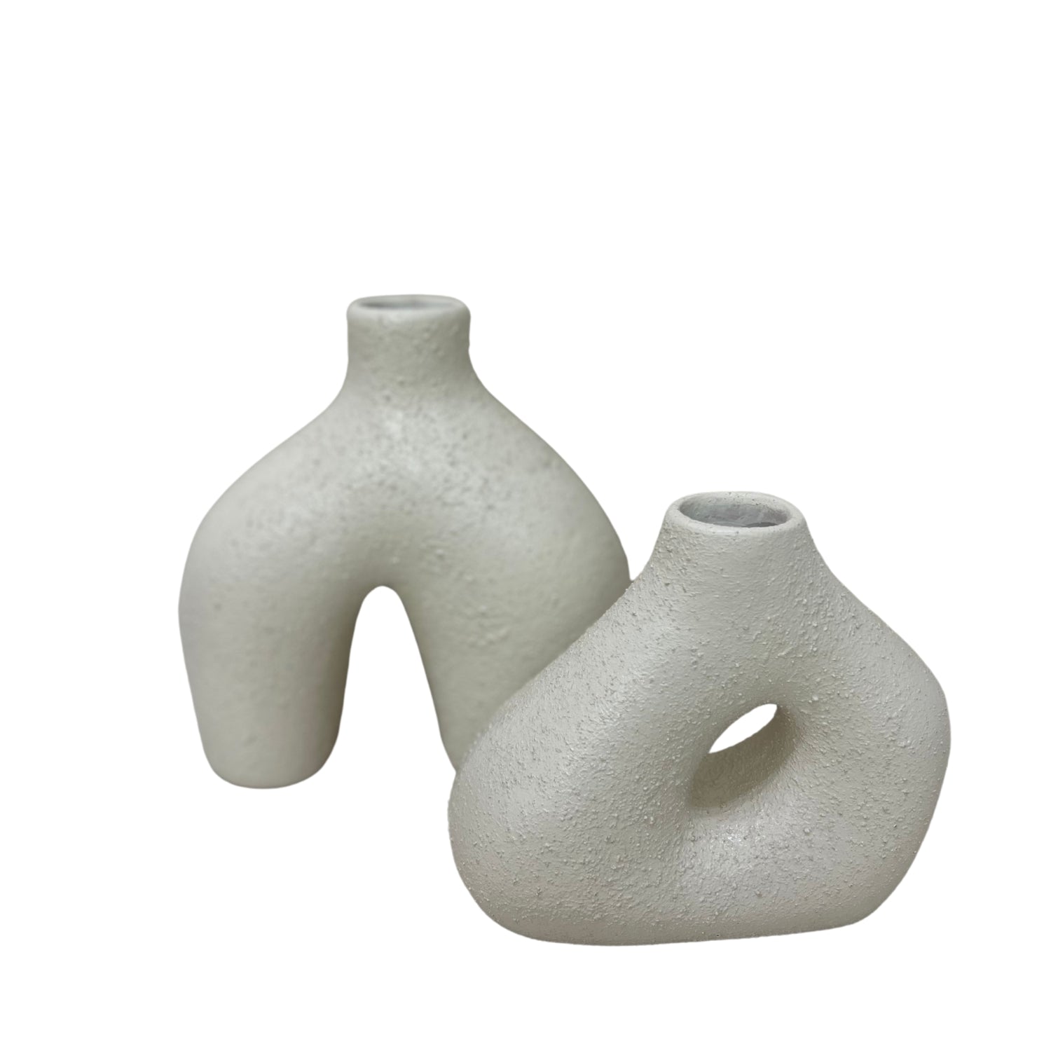 Handcrafted clay accessory vases in a modern design, perfect for home decor and showcasing dried flowers.