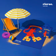 Portable Waterproof Funky Summer Mat with carry bag on a beach with colorful accessories.