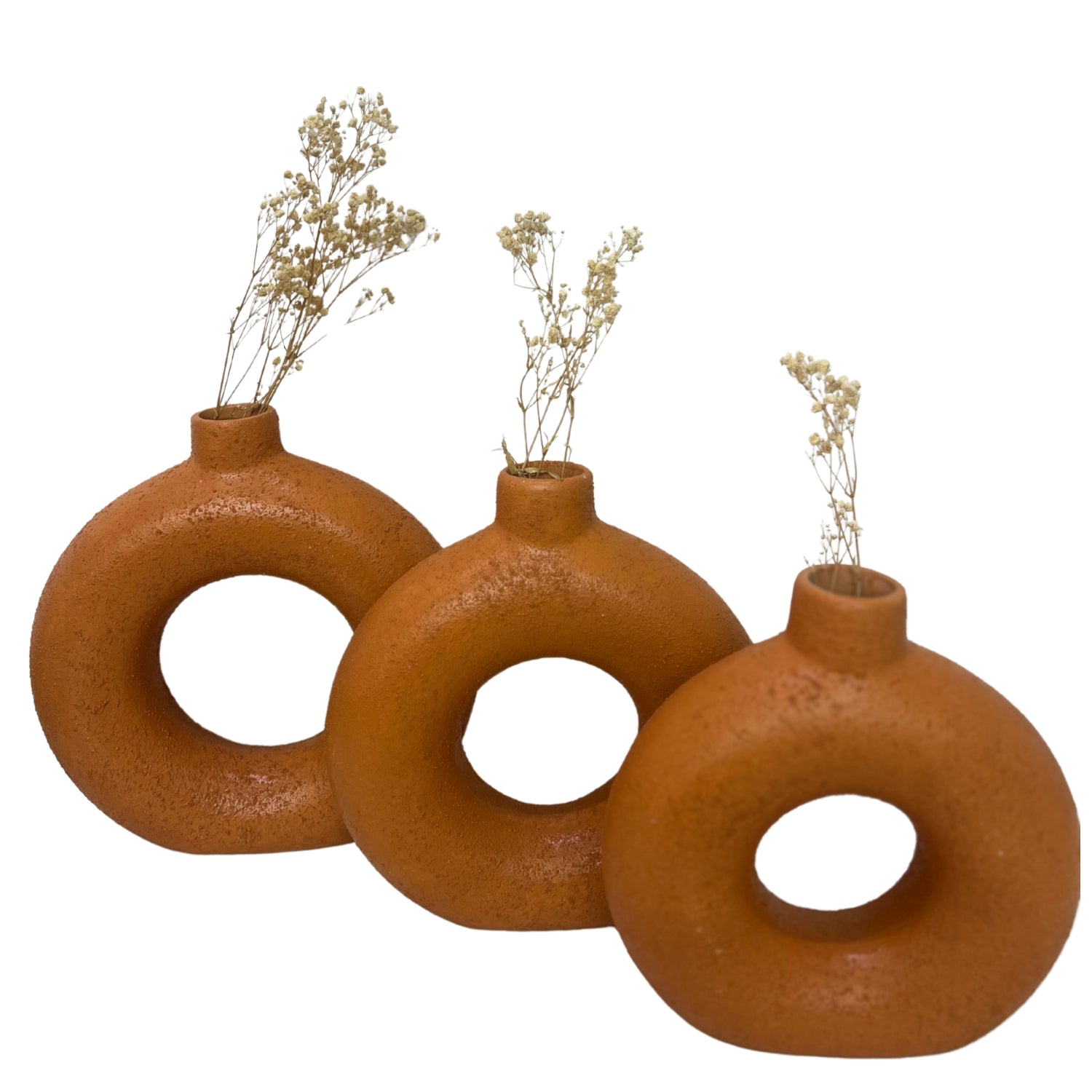 Set of three handcrafted Ronuts Clay Accessory vases with dried flowers for stylish decor.