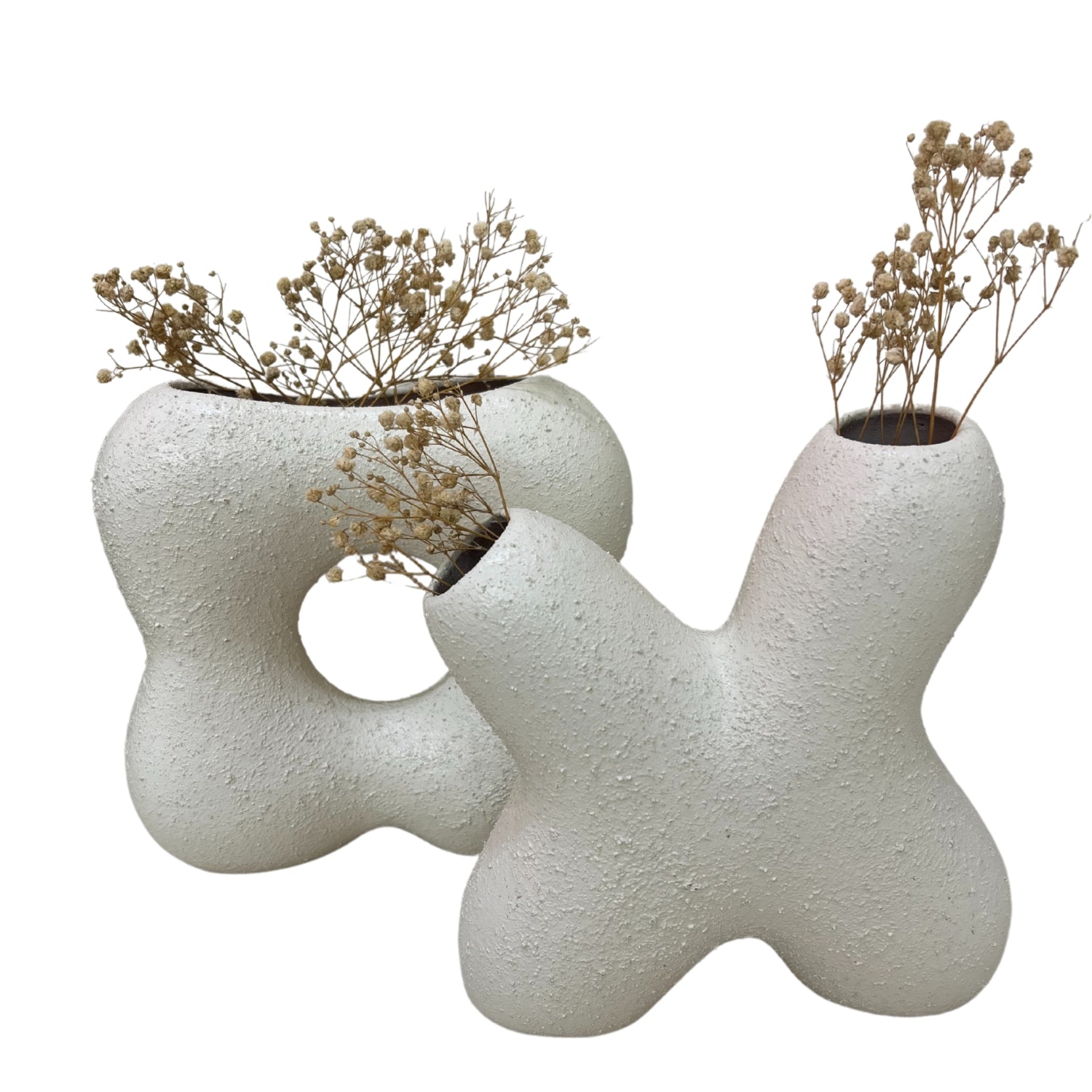Stylish Renzal Clay Accessory vases showcasing dried flowers, perfect for home decor.