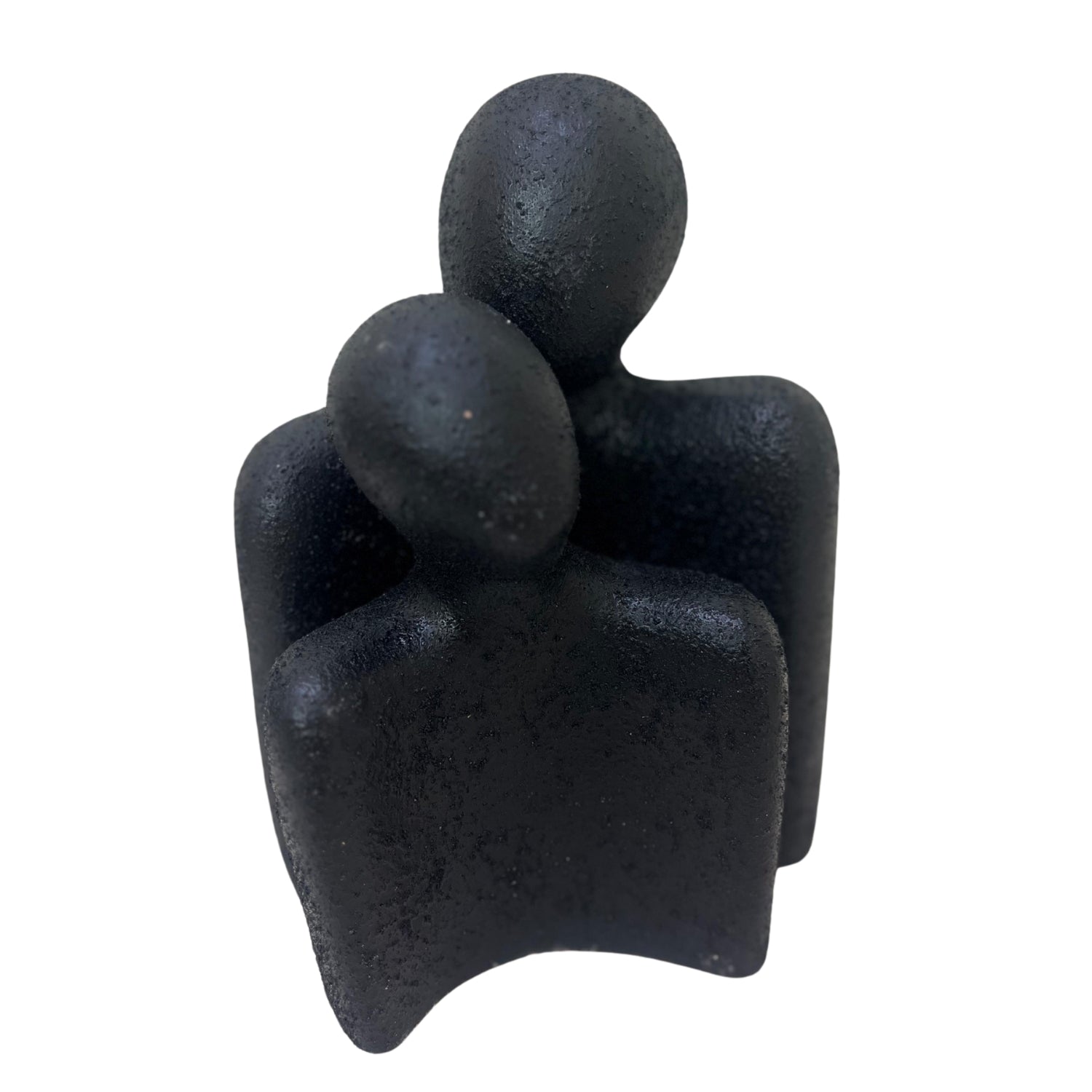 Handcrafted clay accessory featuring two abstract figures embracing, adding character to any space.
