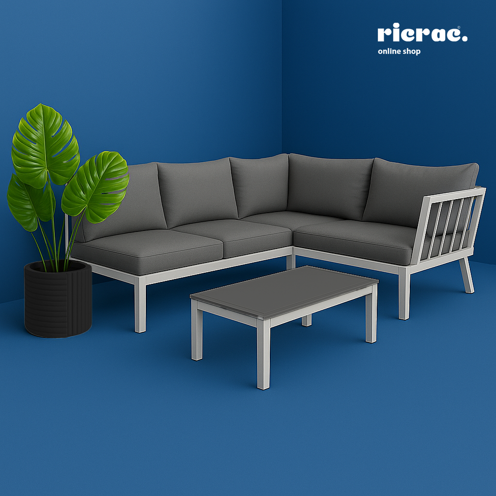 Modern living room featuring a Ravelli Fiberglass Pot with vibrant monstera leaves and a stylish sectional sofa.