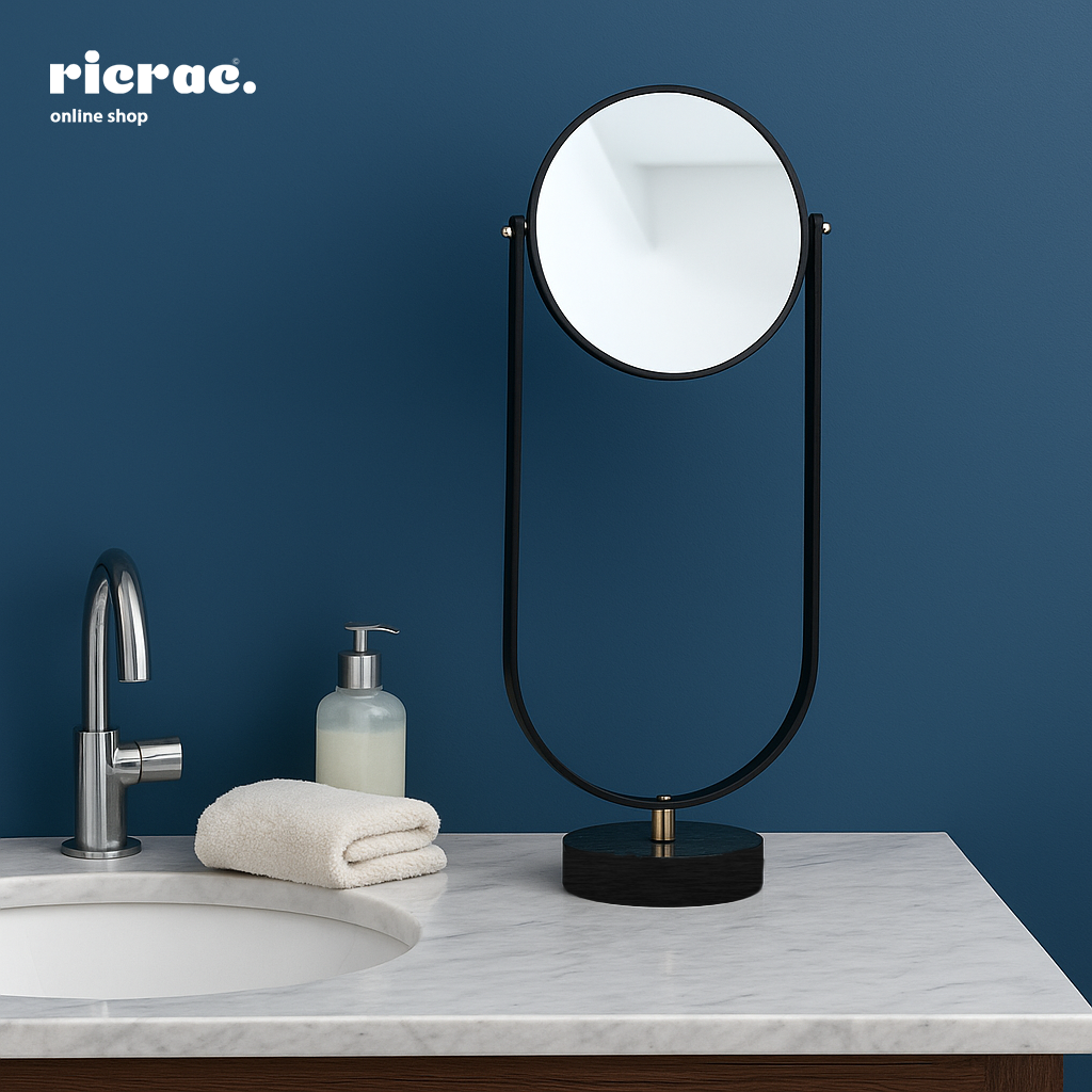 Ravion metal tabletop mirror on a bathroom countertop with modern design and sleek aesthetics.