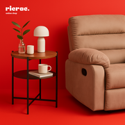 Rinex- Metal Center Table beside a comfortable reclining chair in a modern living room setting.