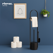 Ruvo- Metal Stand featuring toilet paper, towels, and brush in modern bathroom setting.