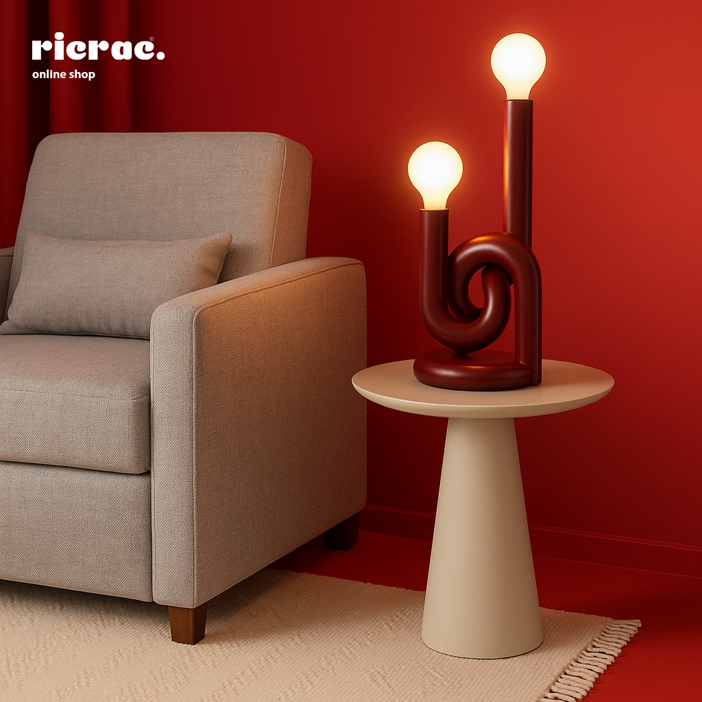 Minimalistic metal lighting unit on a side table next to a cozy armchair in a modern living room.
