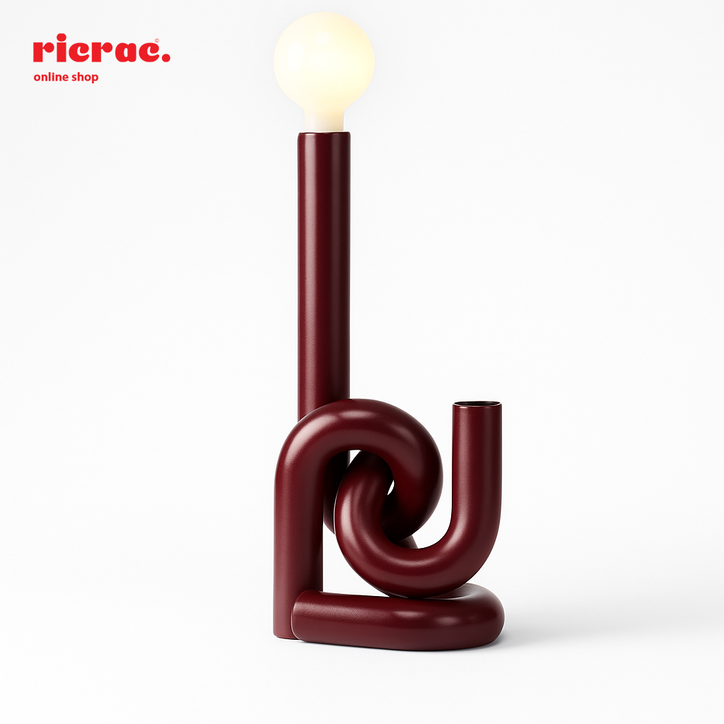 Minimalistic metal lighting unit with a unique twist design and warm glow, ideal for modern decor.