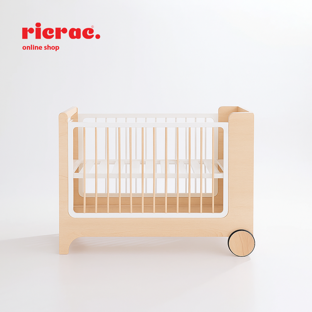 Rolata- Baby Cot Bed in natural wood with white accents and wheels for easy movement.