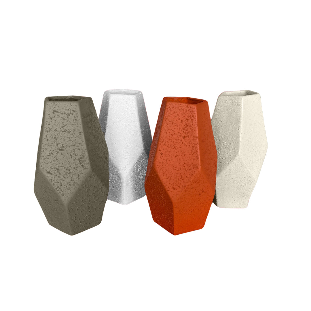Remek- Geometric Clay Vase collection showcasing four faceted vases in different colors: gray, white, orange, and cream.
