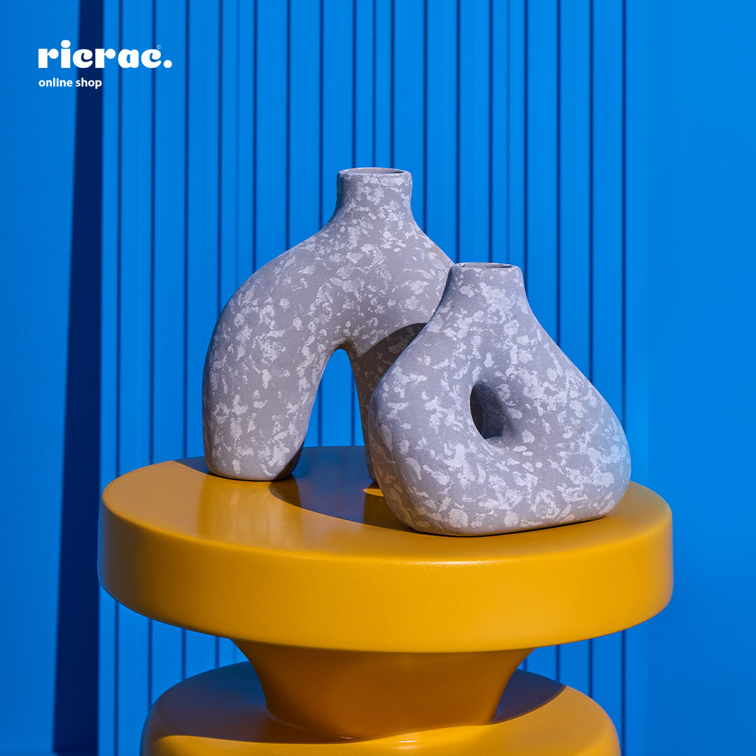Refant Clay Accessory on yellow table, unique shapes and patterns, perfect for decor.