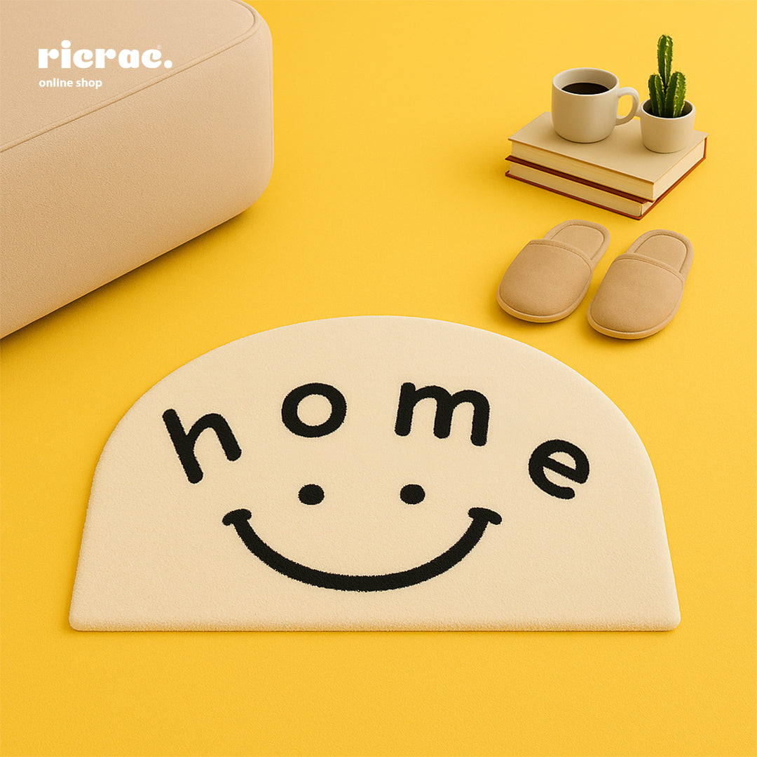 Rani hand tufted rug with a smiley face design and cheerful 'home' message in a cozy living space.