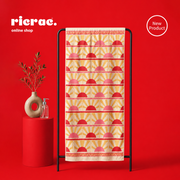 Colorful microfiber towel hanging on a stand with red background and decorative elements.