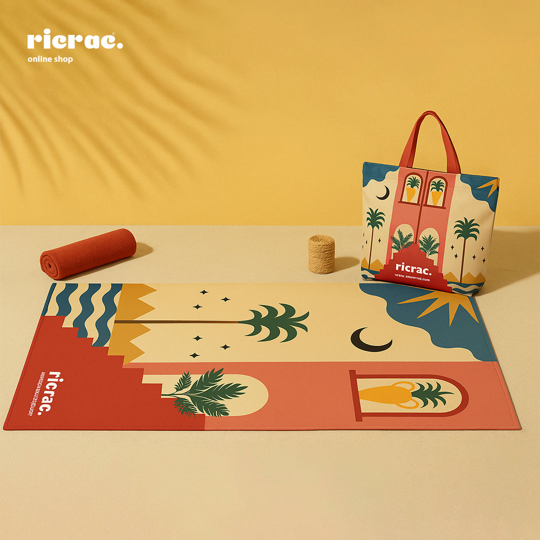 Rihla – Portable Waterproof Boho Beach Mat with carry bag featuring palm trees and pyramids.