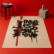 Riota- Printed Rug showcasing bold graffiti-style lettering on a soft background, perfect for modern creative spaces.