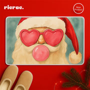 Raroma- Christmas Door Mat featuring a playful Santa with heart-shaped glasses and bubble gum, against a festive red background.