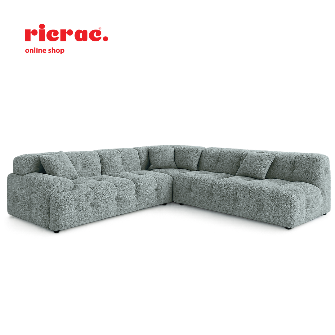L shape modular sofa in light grey fabric with tufted design, perfect for modern interiors.