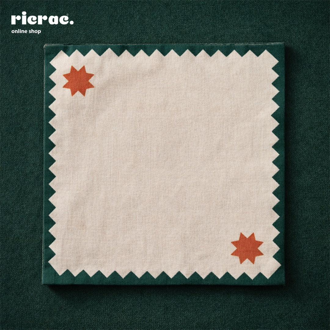 Waterproof cutlery napkins with orange star motifs, featuring a green zigzag border.