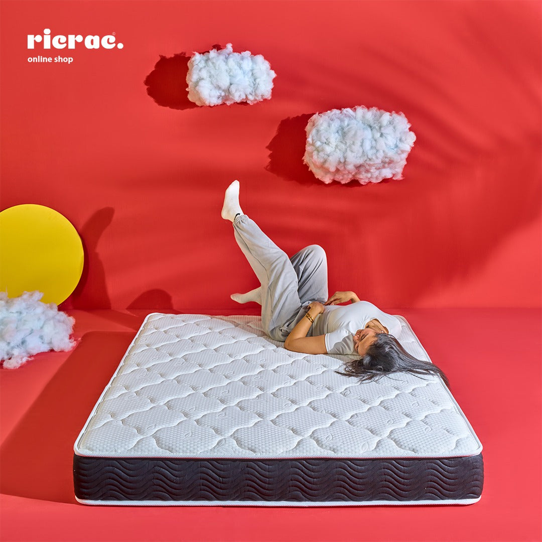 Super Soft Foam Single Layer Pocket Spring Mattress on a vibrant background with a person relaxing on it.