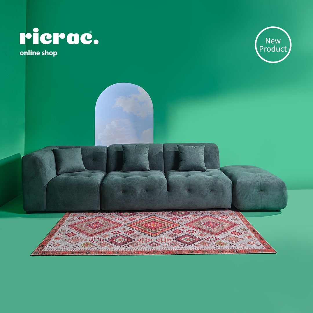 Redano- 3 Seaters Modular Sofa  & a Pouf in a chic living space with a colorful rug.