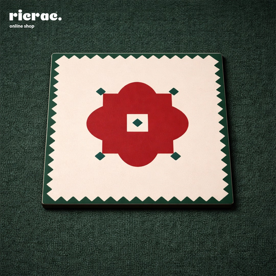 Coasters – Red Flower Motif with Green zigzag border on a table setting