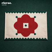 Waterproof Placemats – Red Flower Motif with Green zigzag border on a green background, ideal for stylish dining.