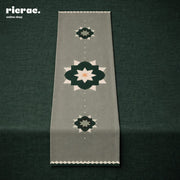 Waterproof Table Runner featuring Islamic pattern with green flower motifs on a muted background.