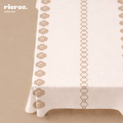 Waterproof geometric table cover in beige with floral and geometric patterns, perfect for Ramadan dining.
