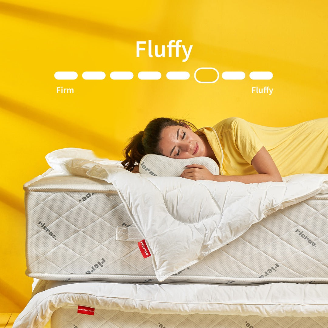 Soft Foam Pocket Spring System Mattress- RTS displayed with a woman comfortably resting on it against a yellow background.