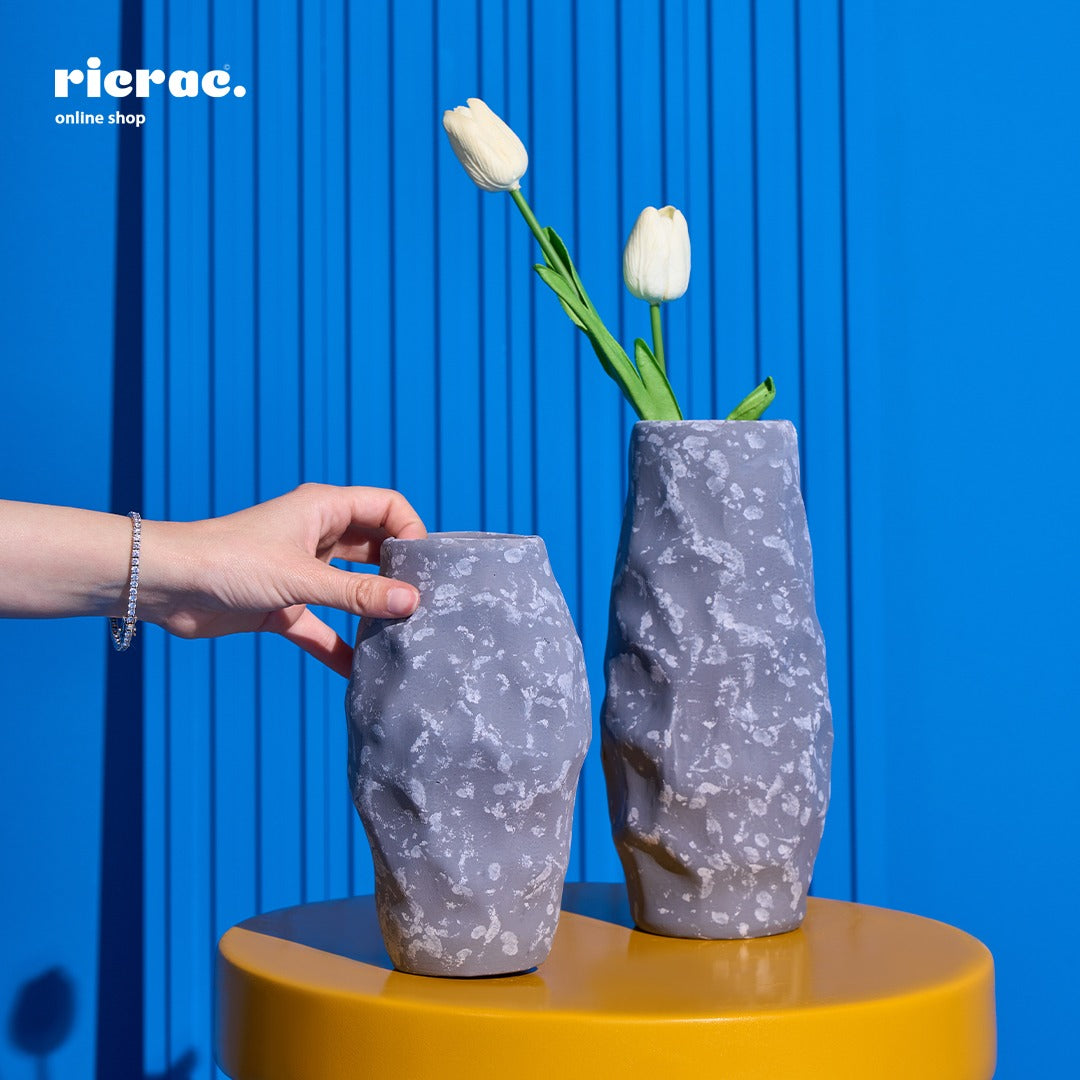 Handcrafted clay accessory vases with tulips, perfect for home decor. Elevate your space with this unique clay accessory.