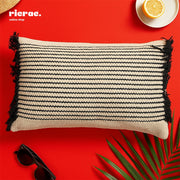 Kilim Cushion- Beige & Black with bold stripe pattern and fringed edges on a vibrant red background