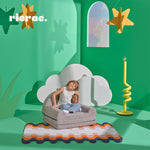Rafeenda- Kids Chair Bed in a colorful playroom setting with a child sitting comfortably.