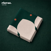 Waterproof cutlery napkins with Islamic patterns featuring orange star motifs on a dark green background.