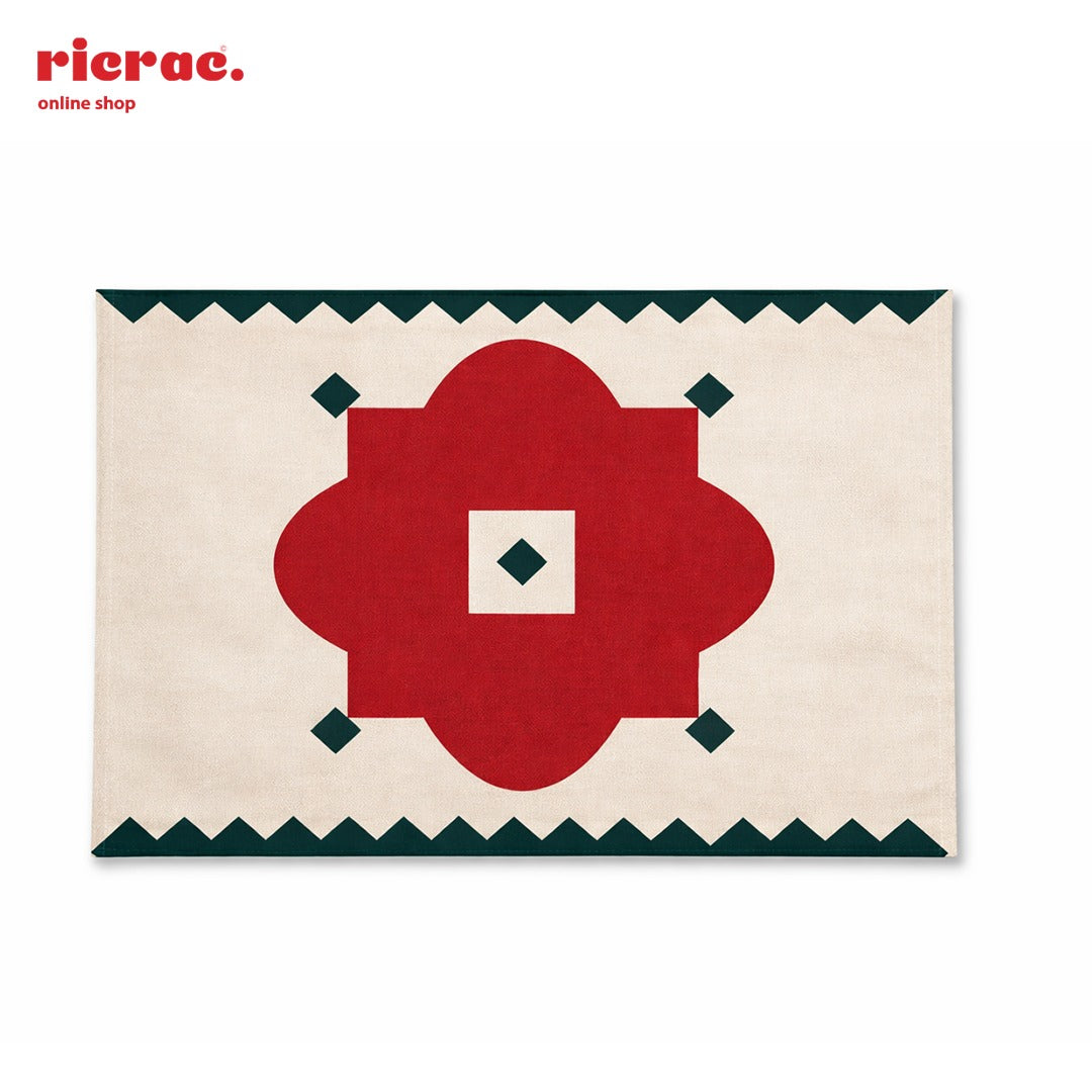 Waterproof Placemats – Red Flower Motif with Green zigzag border on a table