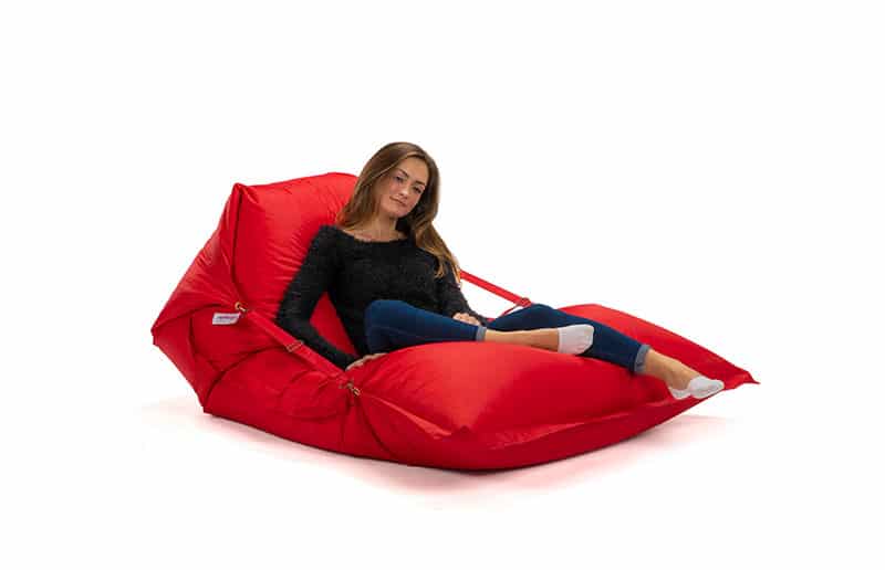 Buggle-up Bean bag Lounge Chair in red with a woman lounging comfortably, perfect as a bean bag chair for indoor and outdoor use.